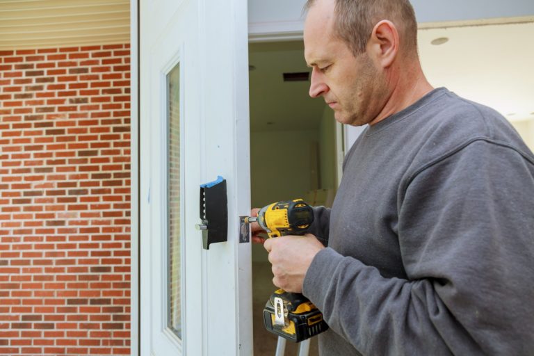 installation-locked-interior-door-woodworker-hands-install-lock-installation-of-the-door-lock-.jpg